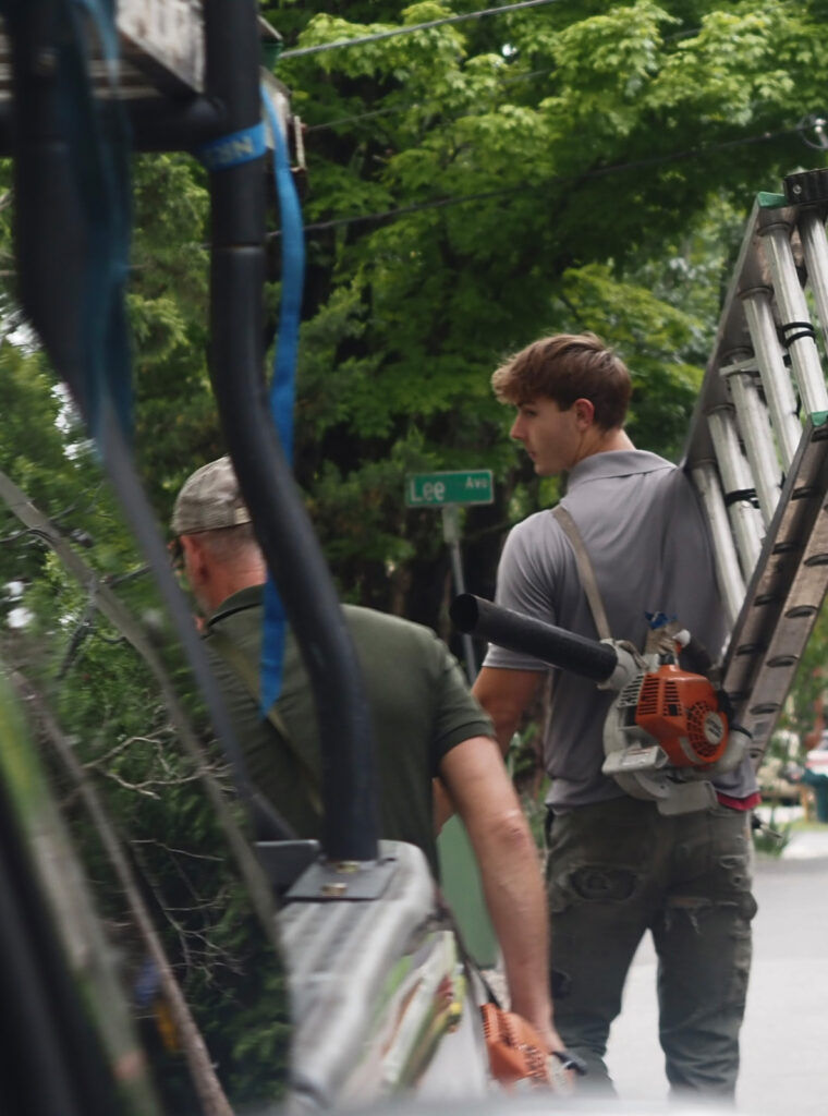 Asheville Gutter Cleaning crew unloading equipment on a residential street